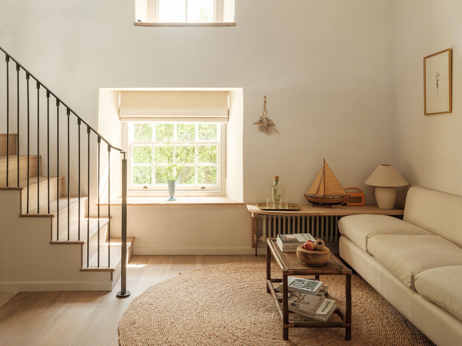 Image may contain Architecture Building Furniture Indoors Living Room Room Lamp Couch Book and Publication