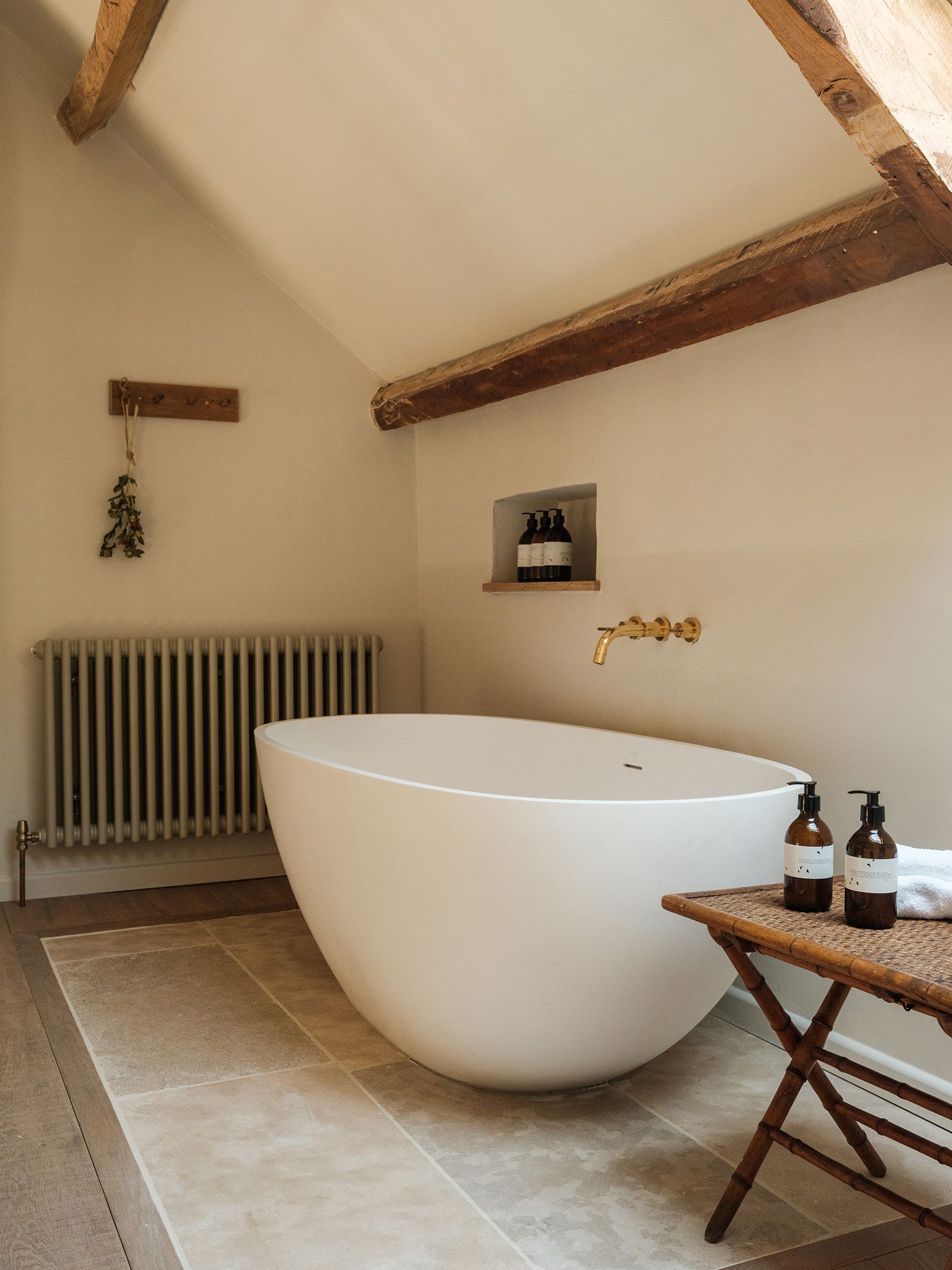 Image may contain Bathing Bathtub Person Tub Desk Furniture Table Indoors Interior Design Sink and Sink Faucet