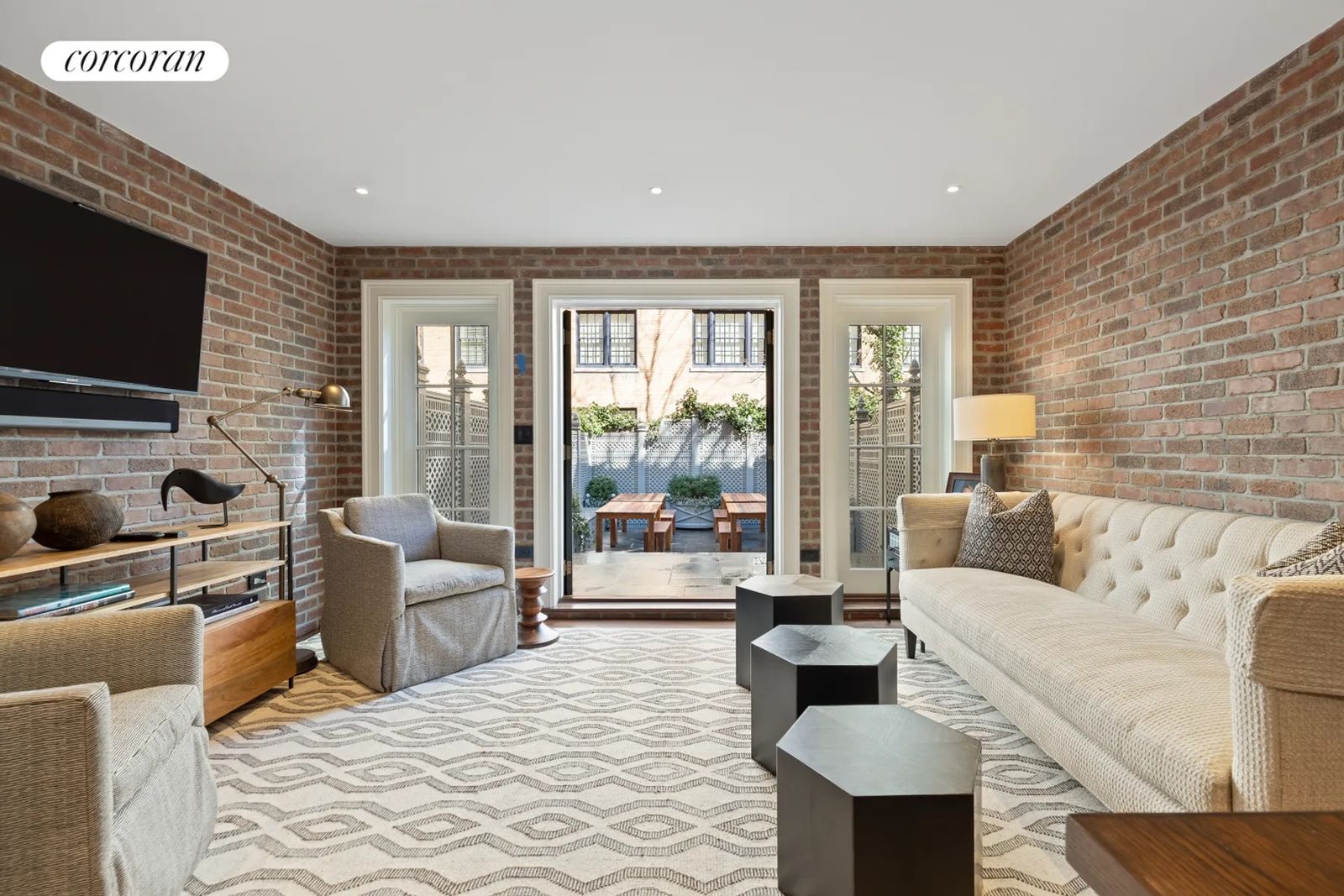 Image may contain Lamp Architecture Building Furniture Indoors Living Room Room Home Decor and Couch