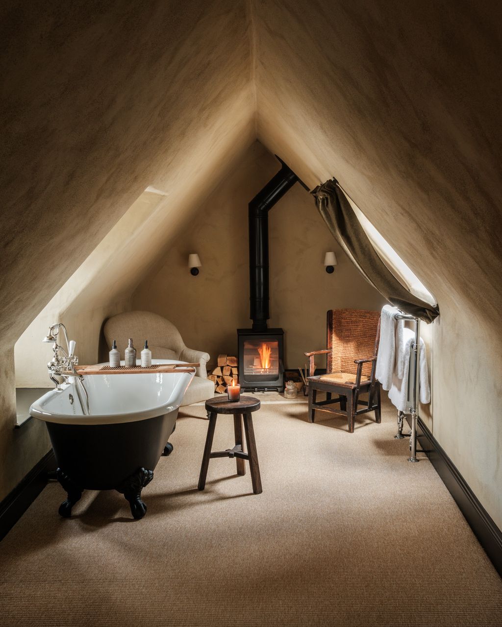 Image may contain Architecture Building House Housing Indoors Loft Room Chair Furniture Bathing and Bathtub