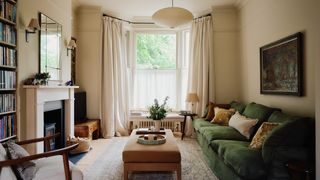 Image may contain Home Decor Lamp Couch Furniture Chair Art Painting Rug Architecture Building and Indoors