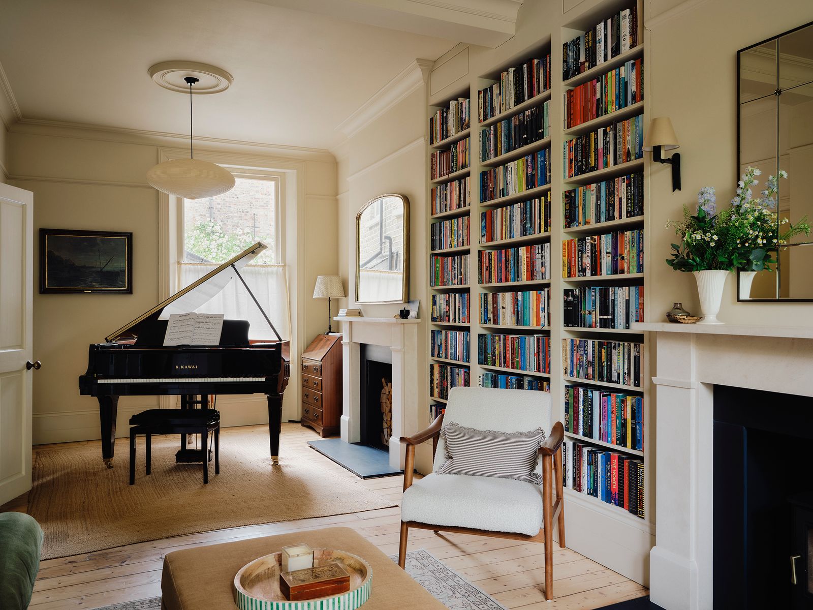 Image may contain Keyboard Musical Instrument Piano Chair Furniture Lamp Home Decor Rug Art Painting and Bench