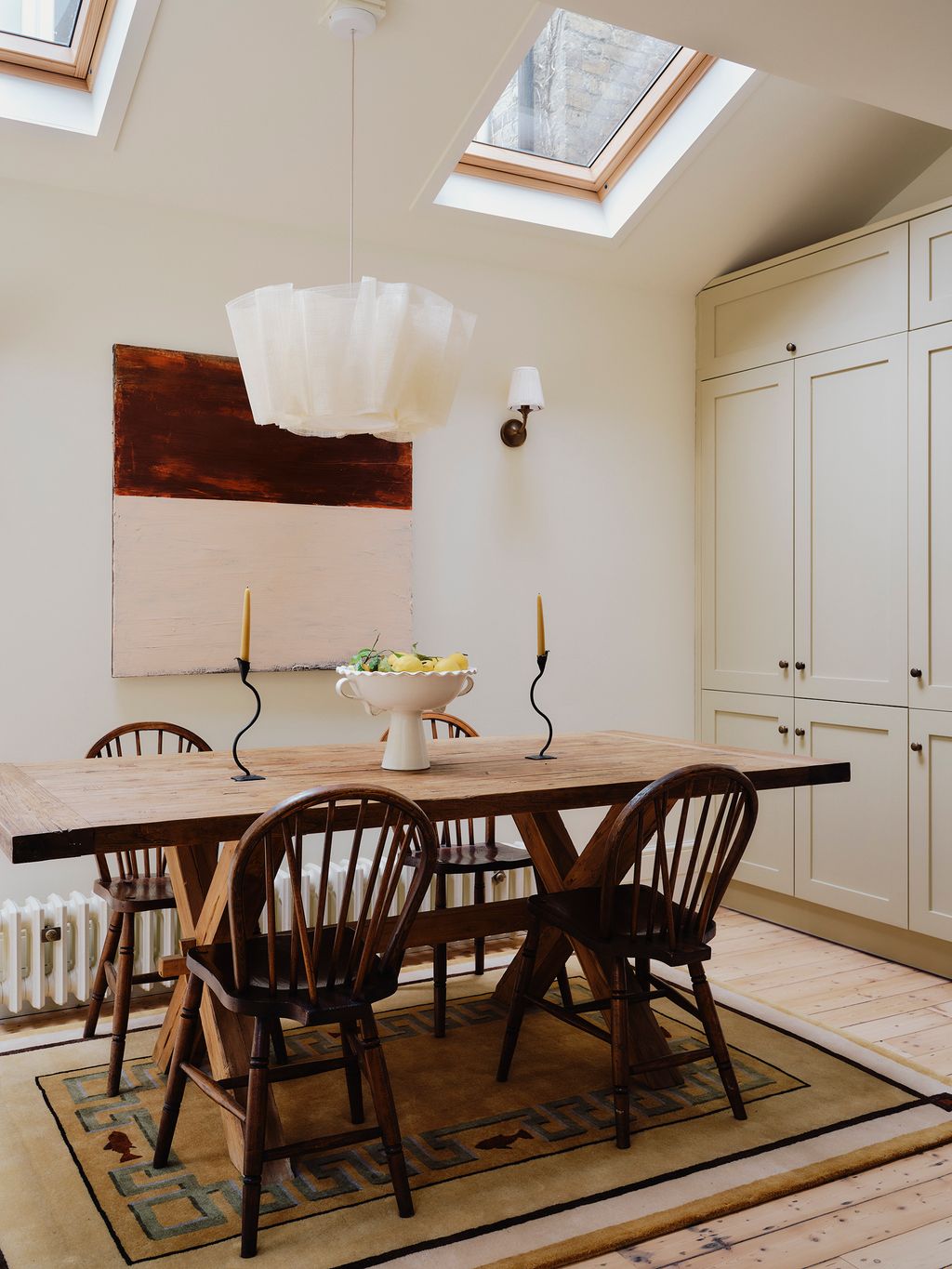 Image may contain Architecture Building Dining Room Dining Table Furniture Indoors Room Table and Lamp