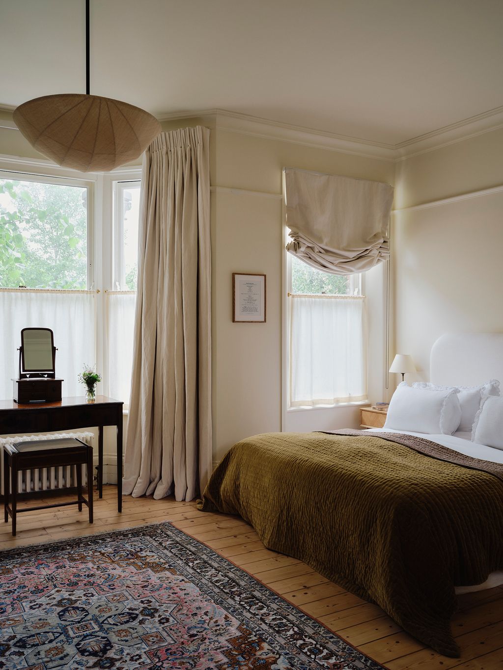 Image may contain Home Decor Lamp Desk Furniture Table Rug Bed Indoors Interior Design Art Painting and Plant