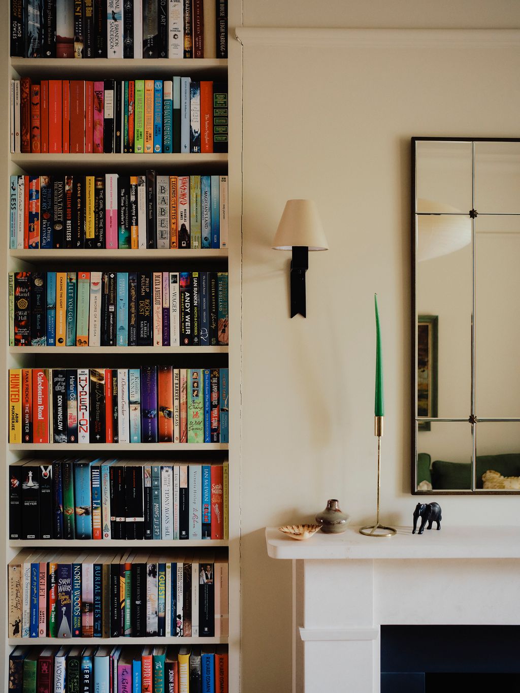 Image may contain Furniture Lamp Bookcase Art Painting Animal Canine Dog Mammal Pet Bread and Food