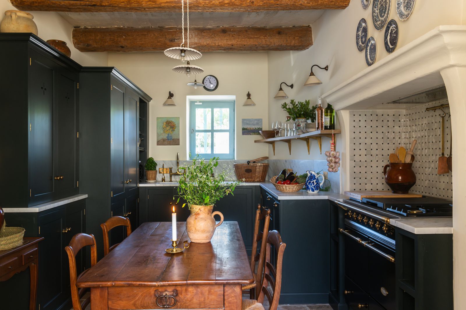 Image may contain Indoors Interior Design Lamp Plant Kitchen Architecture Building Dining Room and Dining Table