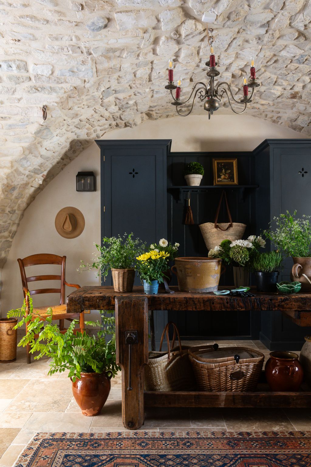 Image may contain Indoors Interior Design Lamp Plant Chair Furniture Architecture Building Living Room and Room