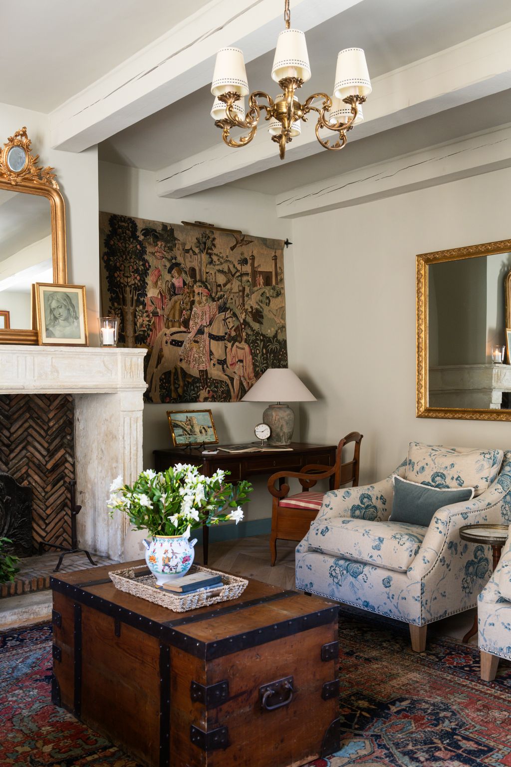 Image may contain Home Decor Lamp Chair Furniture Architecture Building Indoors Living Room Room Art and Painting