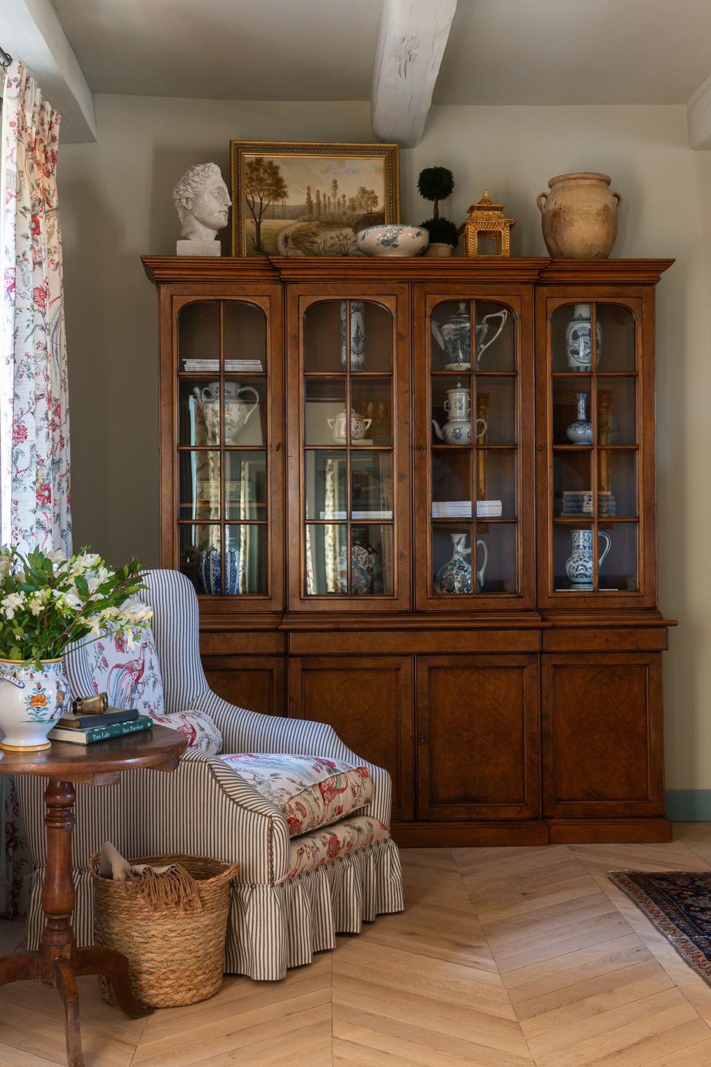 Image may contain Scopas Cabinet Furniture Plant Indoors Interior Design China Cabinet Desk Table Person and Book