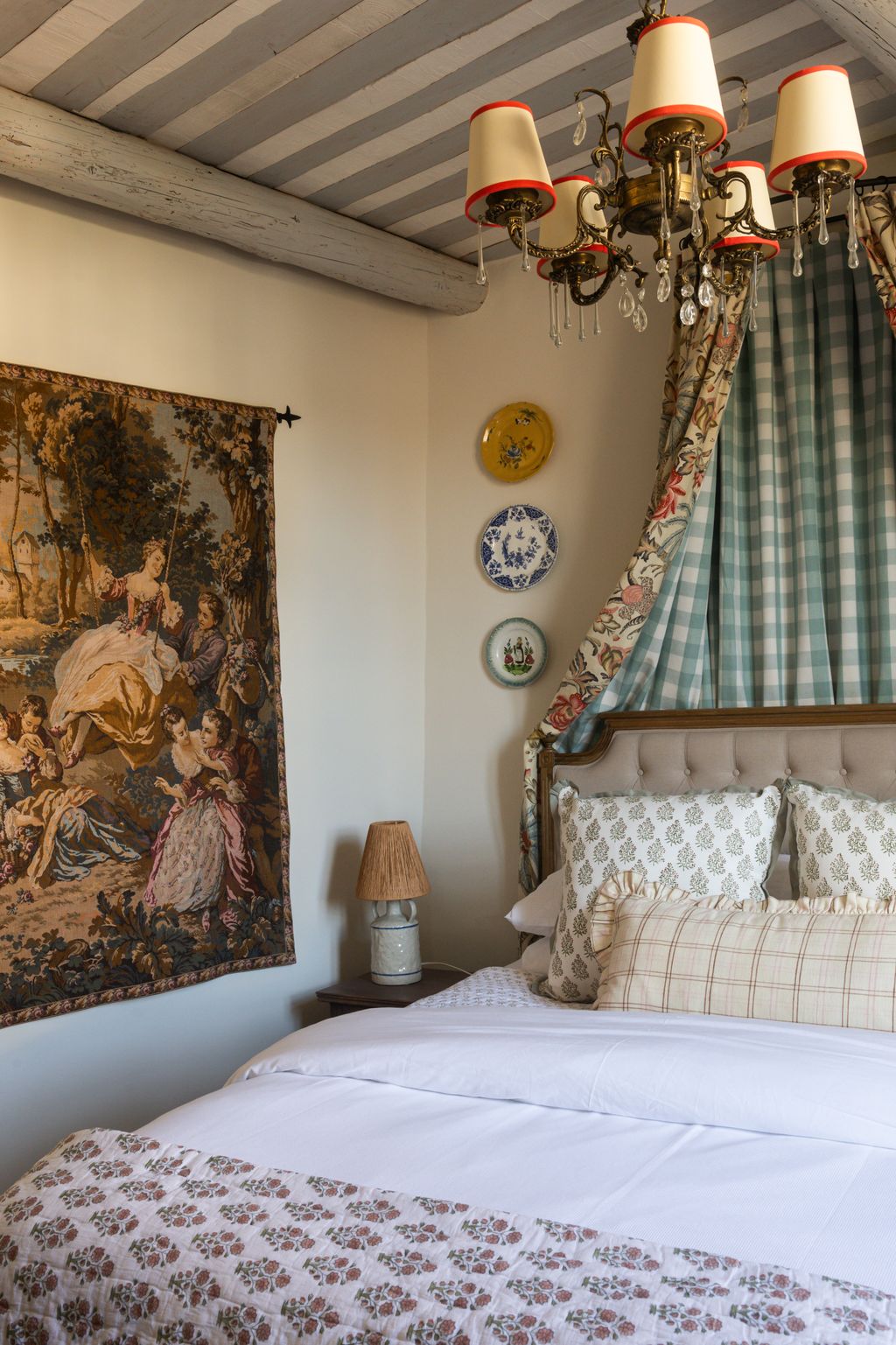 Image may contain Lamp Home Decor Chandelier Bed Furniture Indoors Interior Design Cushion Plate Bedroom and Room