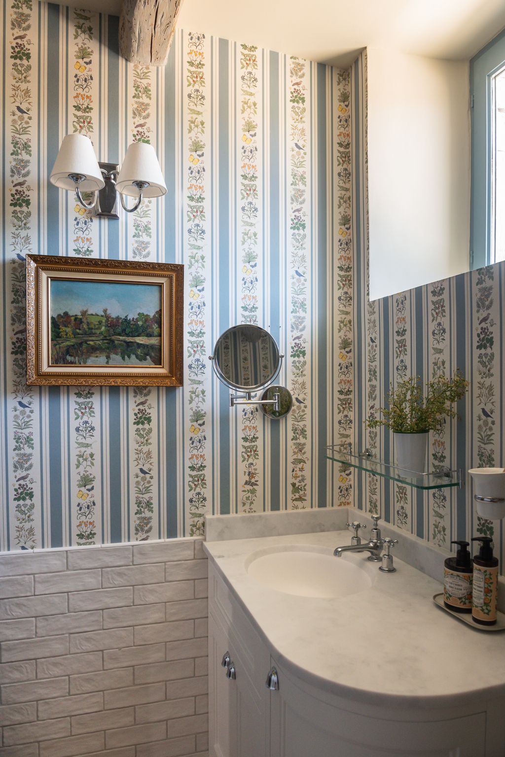 Image may contain Indoors Interior Design Sink Art Painting Lamp Sink Faucet Plant and Corner