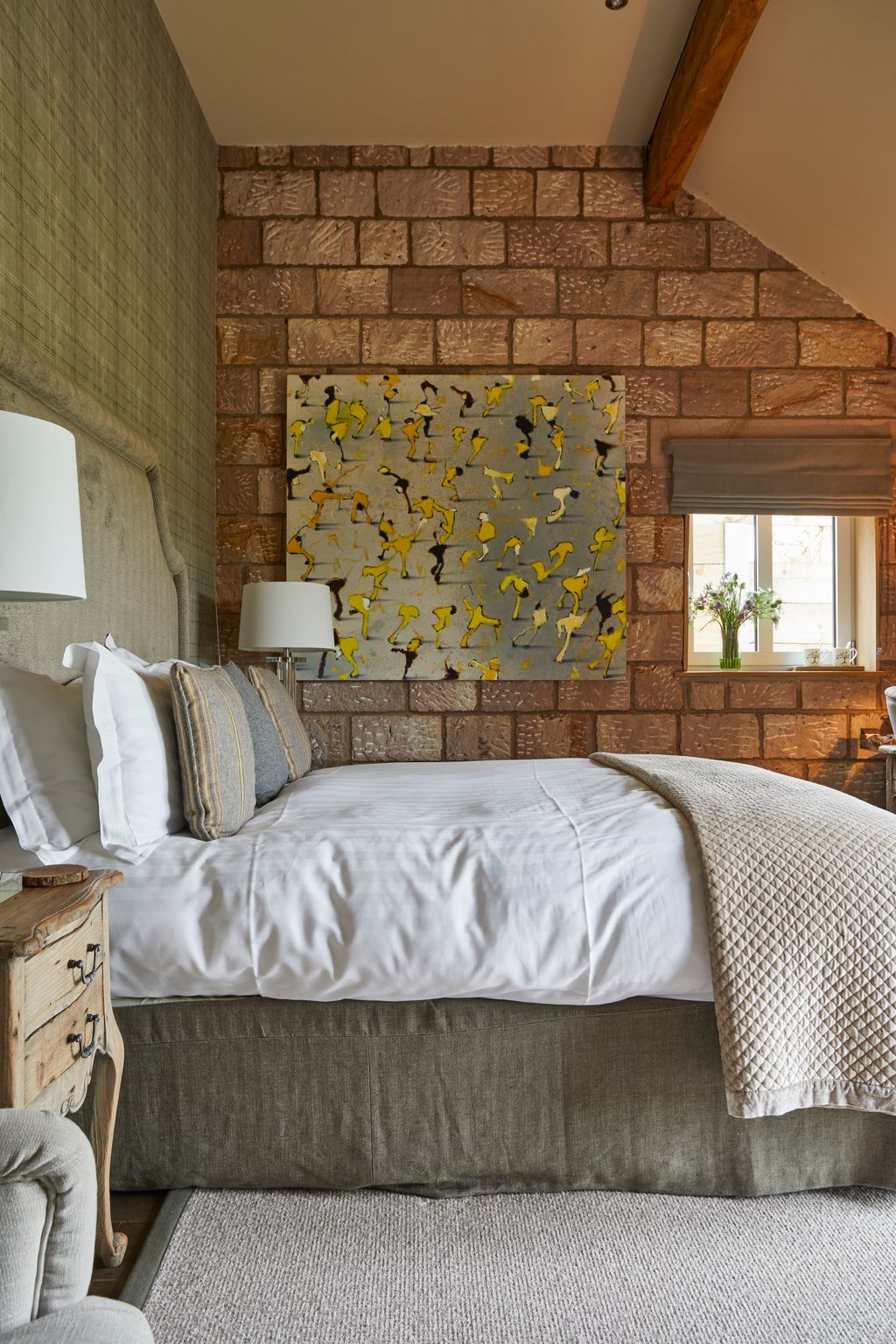 Image may contain Indoors Interior Design Wood Panels Home Decor Cushion Lamp Bed Furniture Bedroom Room and Couch