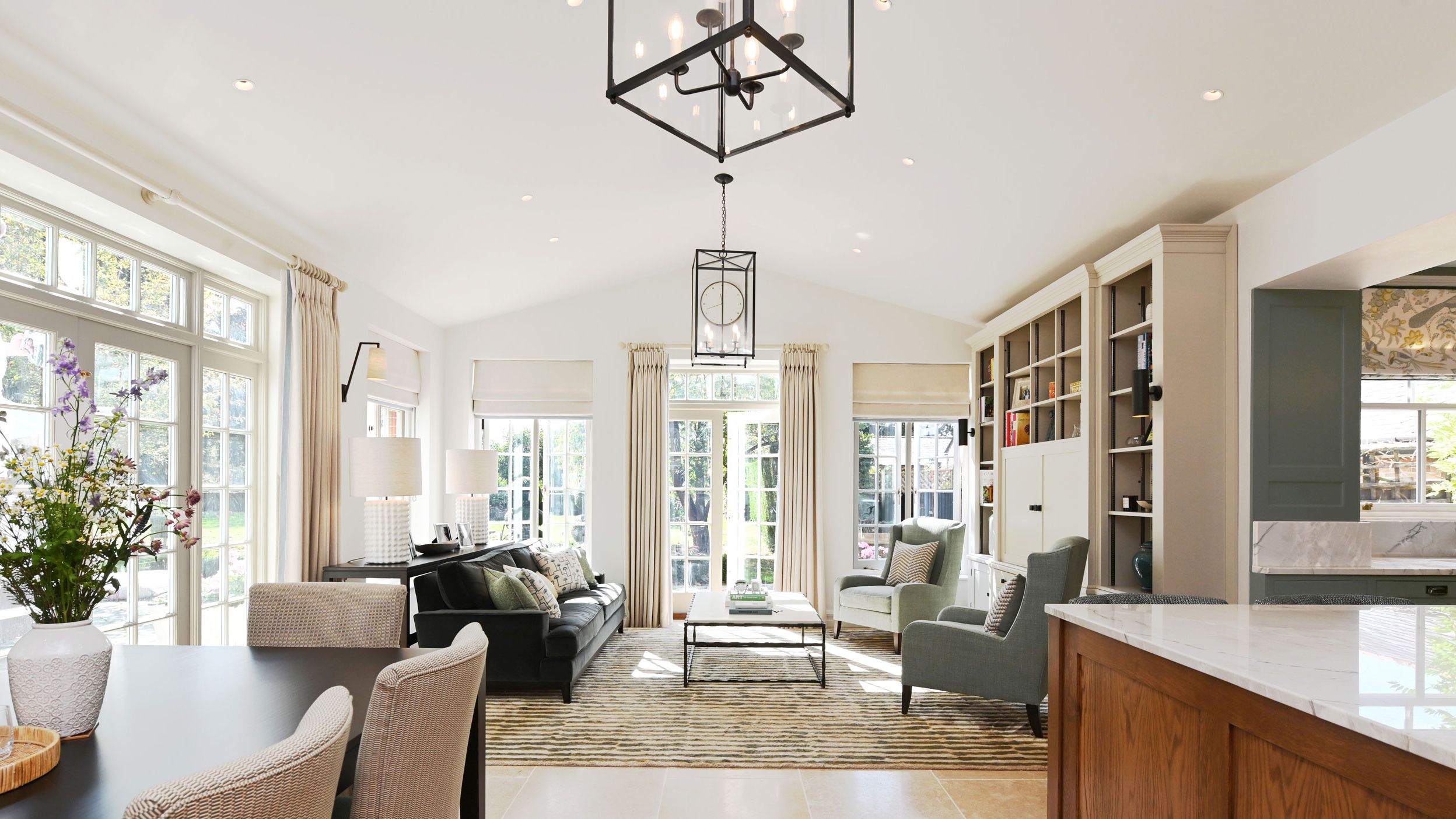 Image may contain: Door, Chair, Furniture, Home Decor, Lamp, Architecture, Building, Dining Room, Dining Table, and Indoors