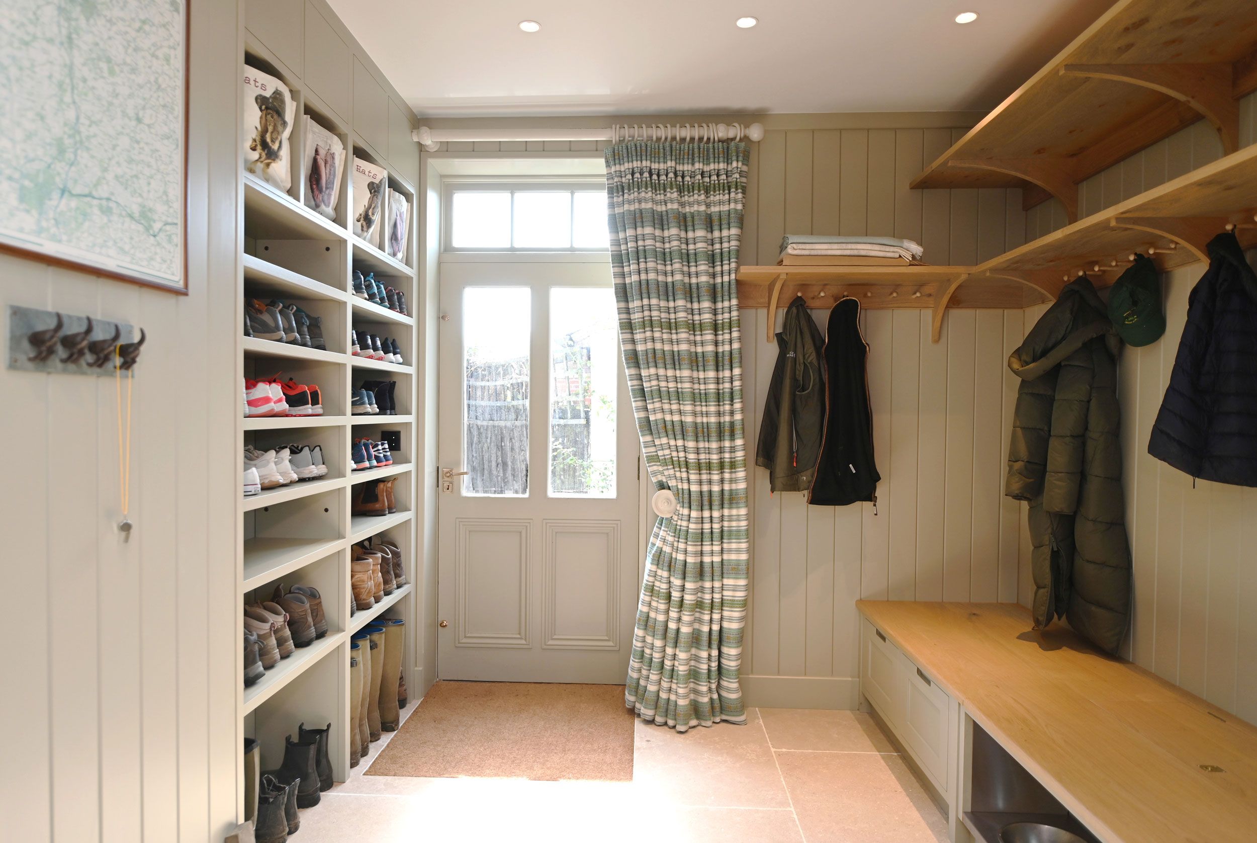 Image may contain: Furniture, Indoors, Room, Walk-In Closet, Clothing, Hat, Home Decor, Rug, Footwear, Shoe, and Closet