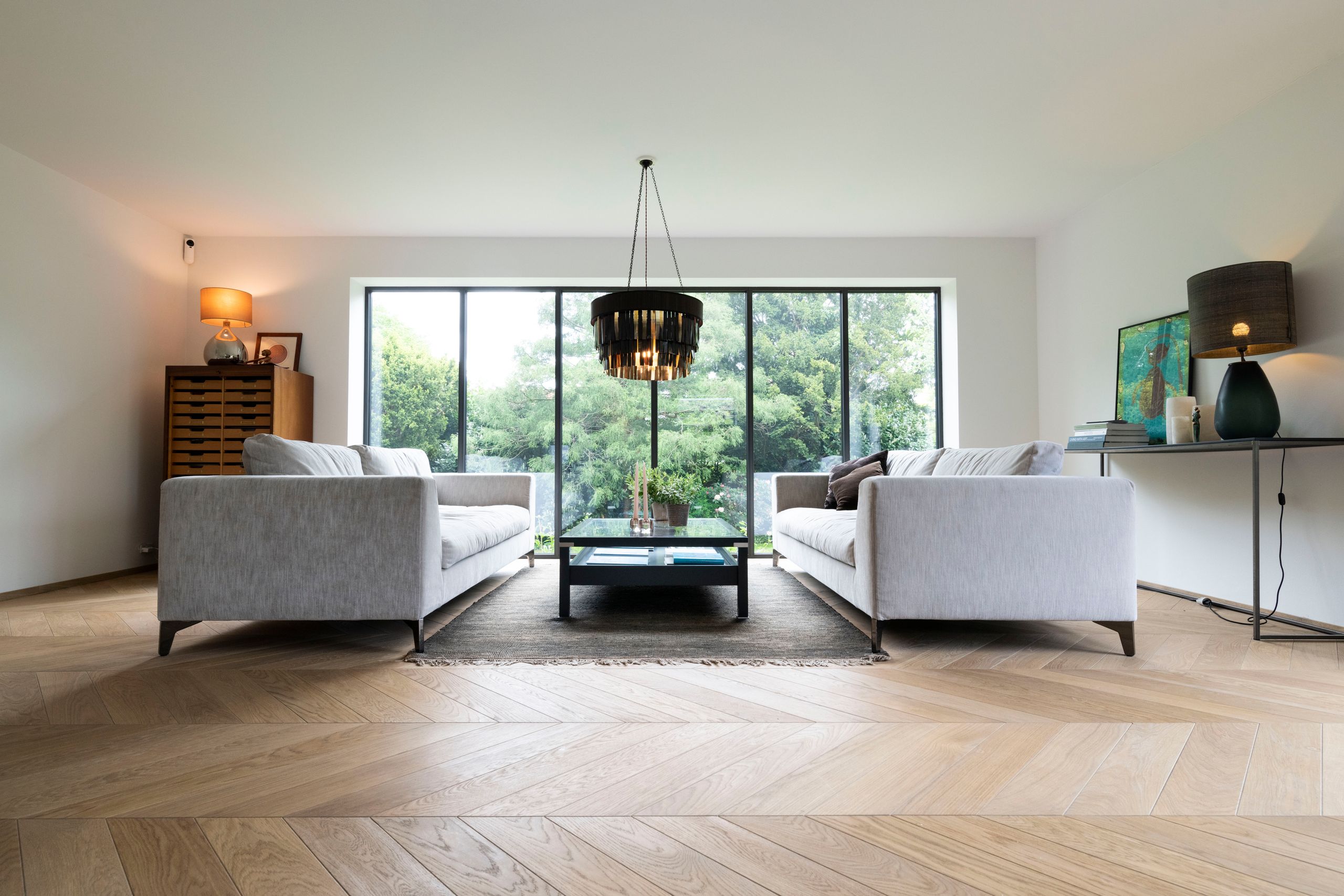 Image may contain: Couch, Furniture, Home Decor, Lamp, Floor, Coffee Table, Table, Flooring, Architecture, and Building