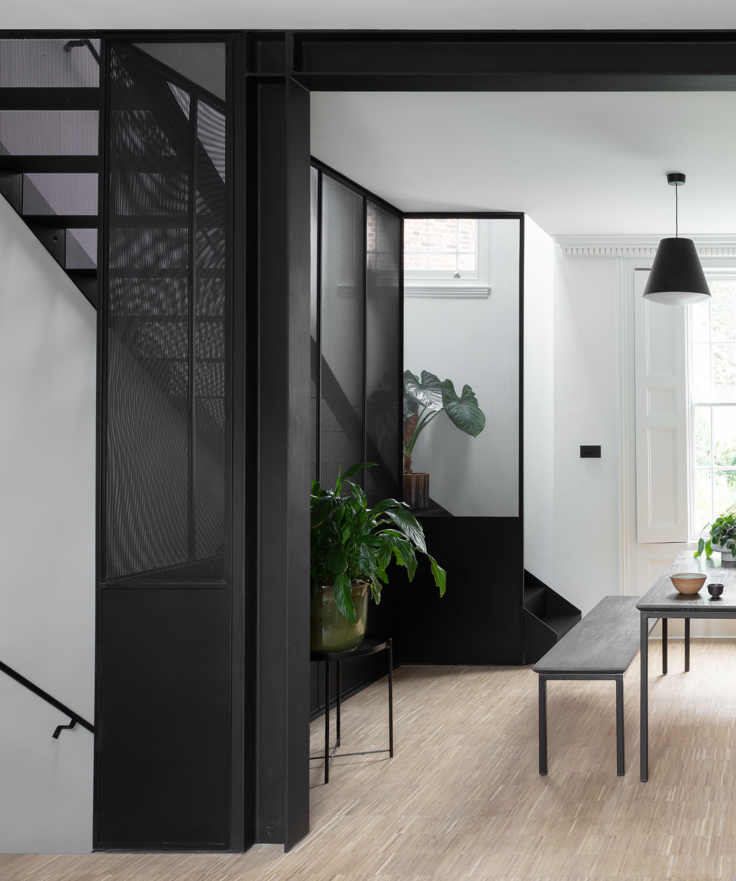 Image may contain: Indoors, Interior Design, Plant, Architecture, Building, House, Housing, Staircase, Door, Floor, and Foyer