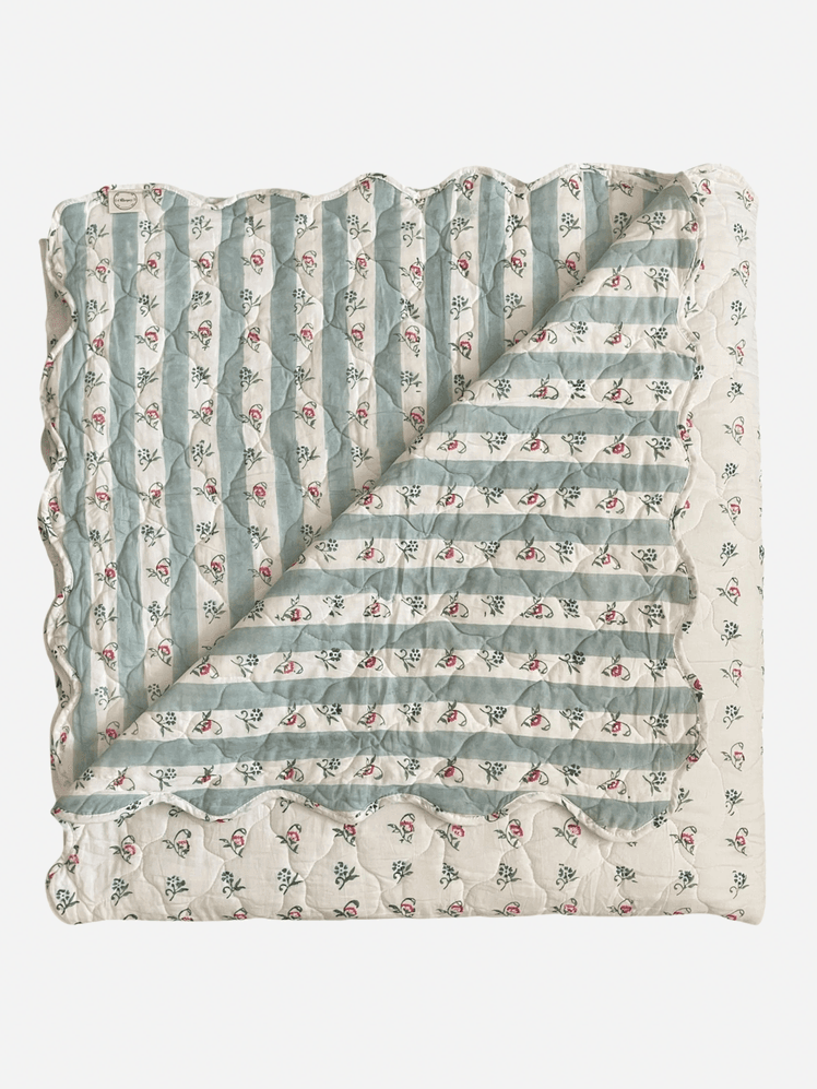 Image may contain: Blanket, Furniture, Quilt, and Diaper