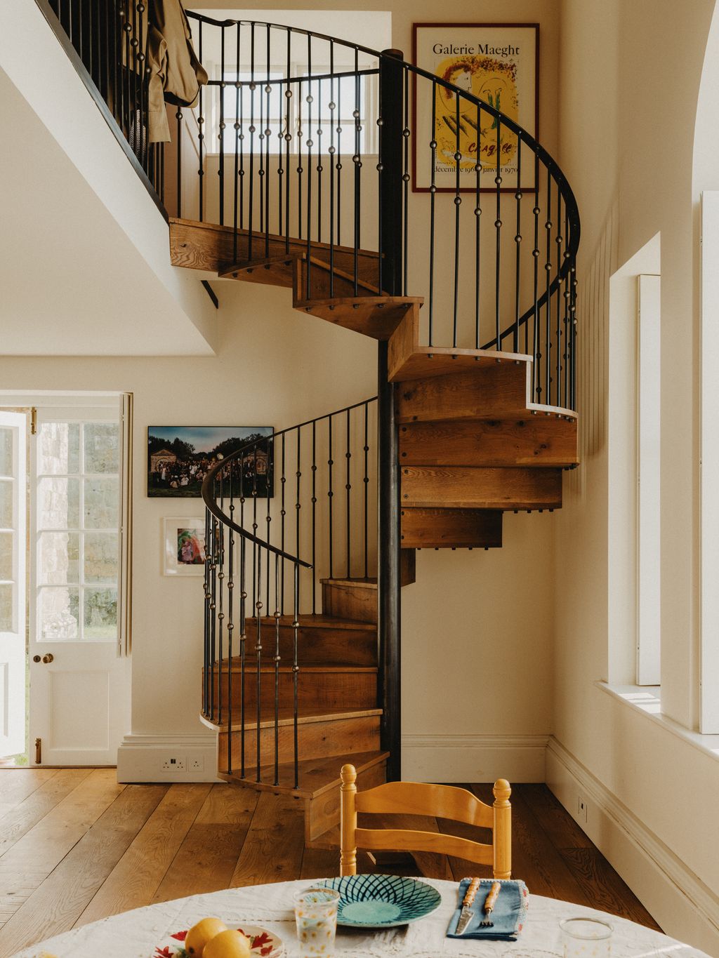 Image may contain Architecture Building House Housing Staircase Cup Chair Furniture Foyer Indoors Blade and Knife