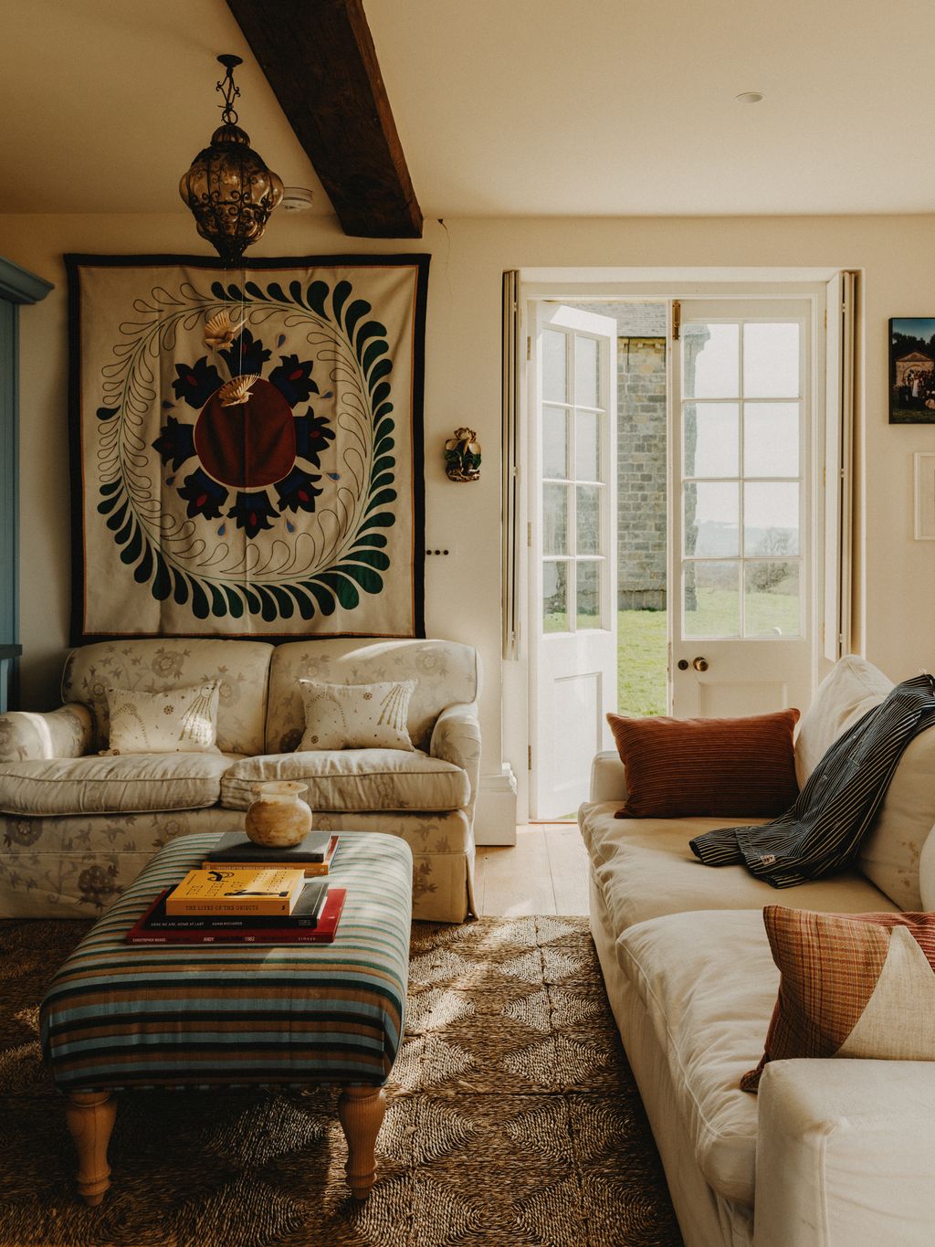 Image may contain Home Decor Couch Furniture Book Publication Rug Lamp Architecture Building and Indoors