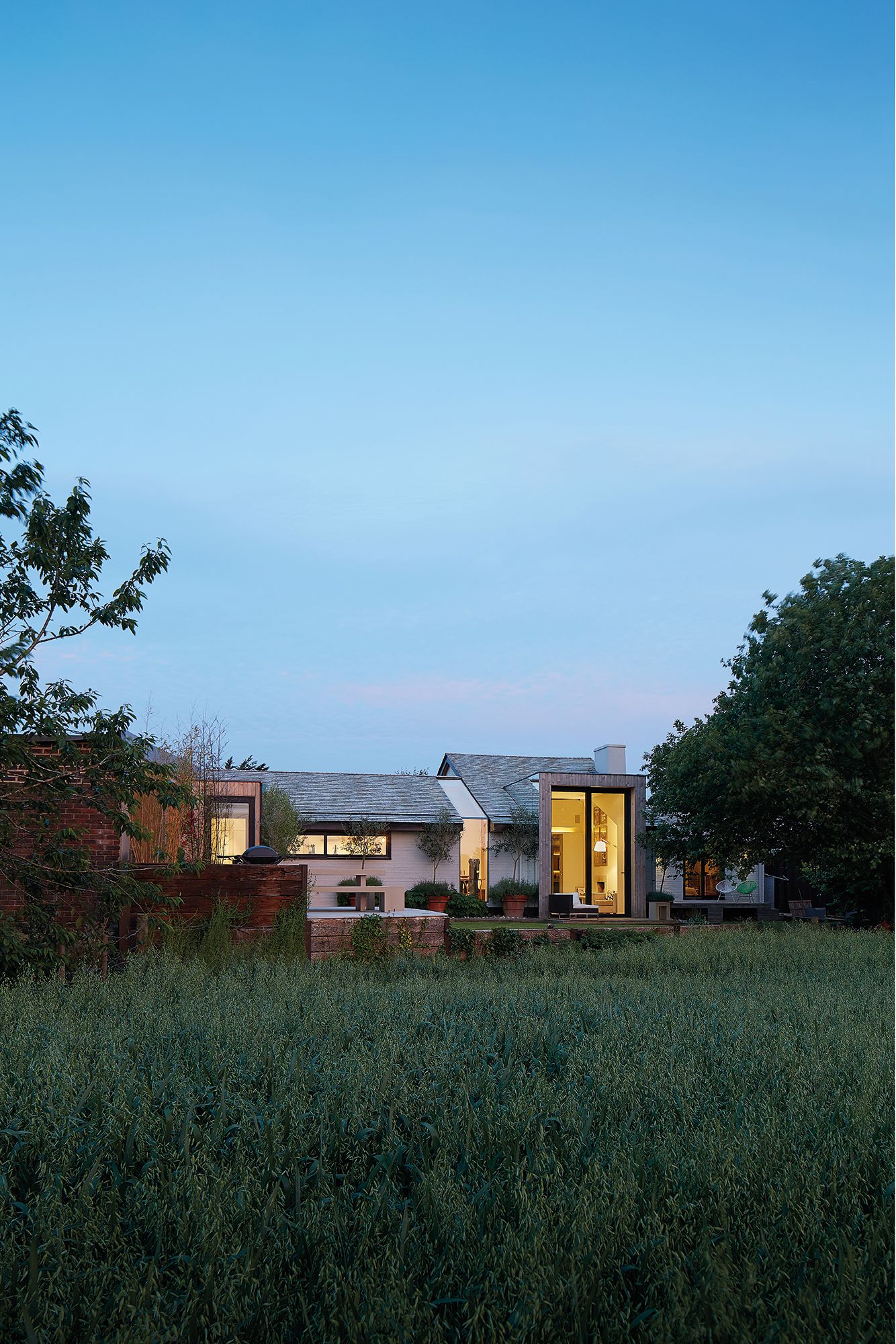 Image may contain: Grass, Plant, Architecture, Building, Outdoors, Shelter, Housing, Nature, Suburb, House, and Countryside