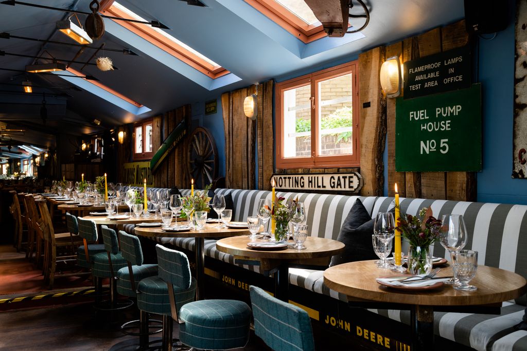 Image may contain Indoors Restaurant Dining Table Furniture Table Chair Architecture Building Dining Room and Room