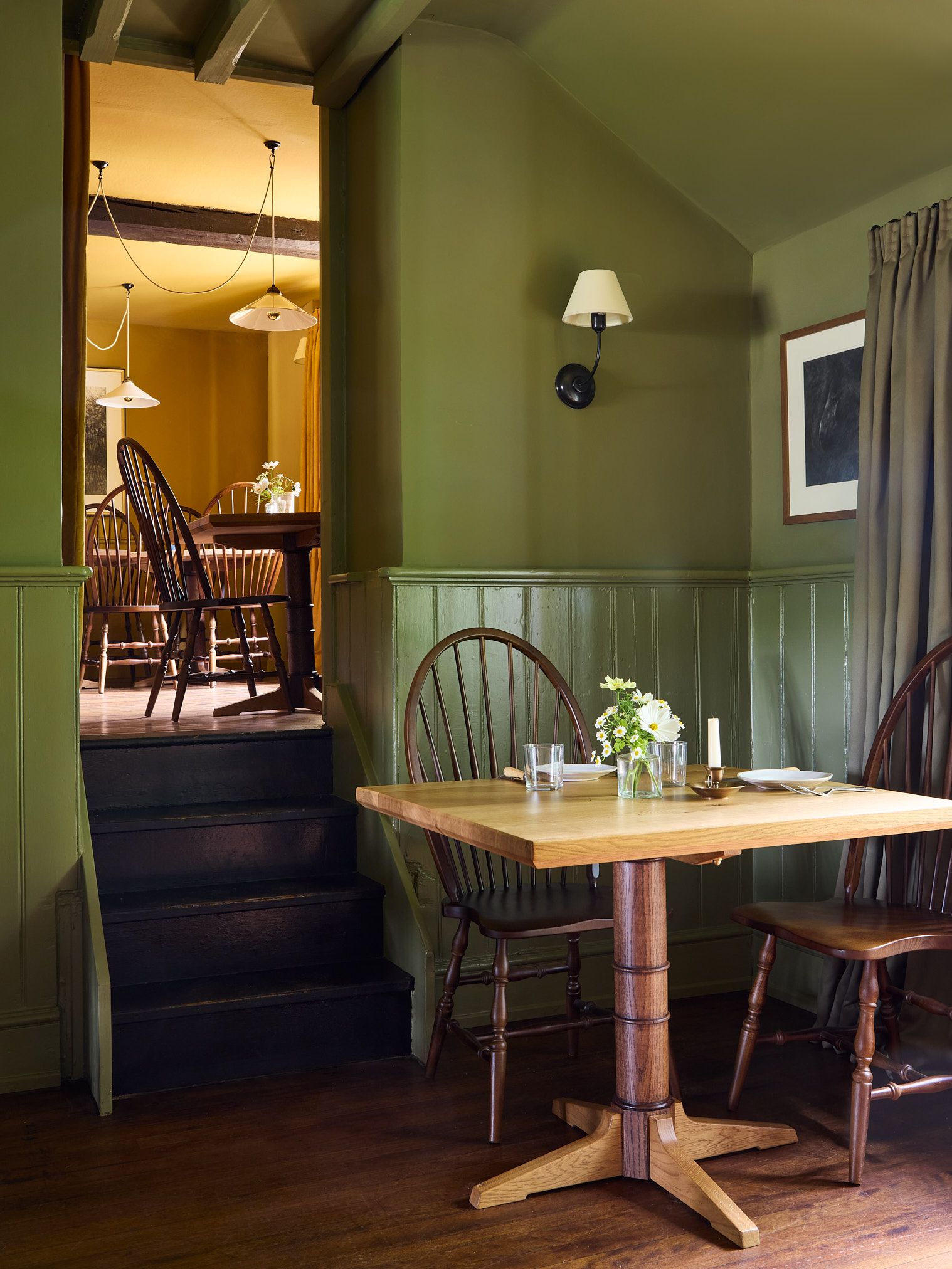 Image may contain Dining Table Furniture Table Architecture Building Dining Room Indoors Room and Lamp