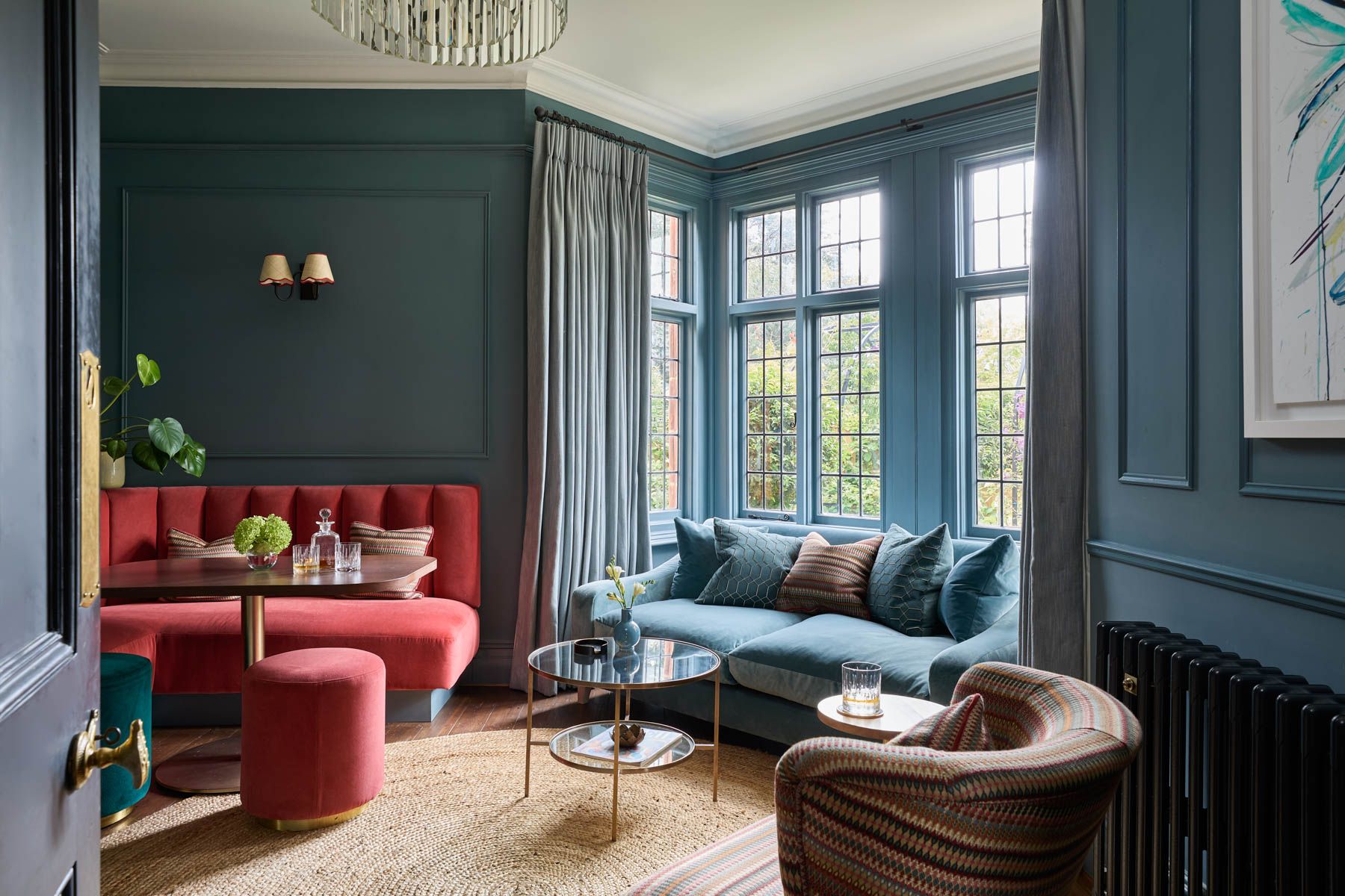 Image may contain: Home Decor, Plant, Cup, Lamp, Rug, Couch, Furniture, Architecture, Building, Indoors, and Living Room