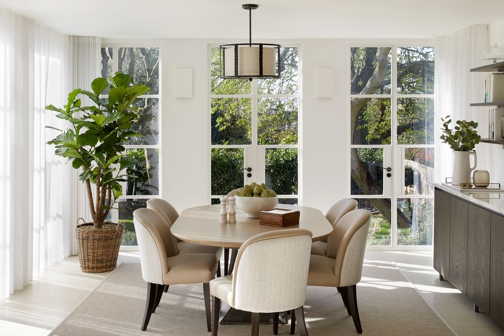 Image may contain Architecture Building Dining Room Dining Table Furniture Indoors Room Table Plant and Chair