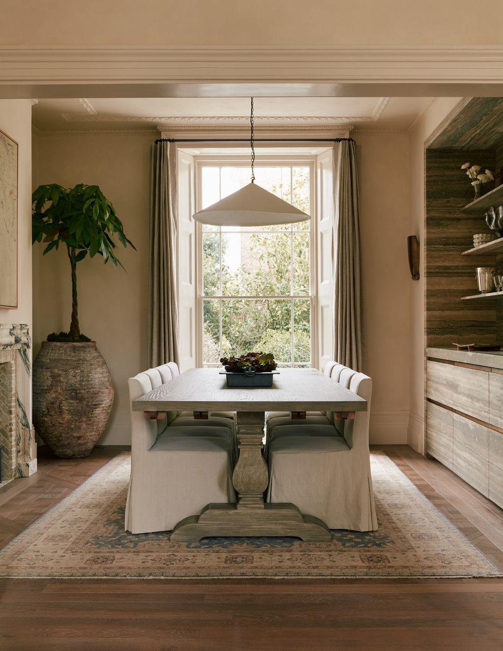 Image may contain Architecture Building Dining Room Dining Table Furniture Indoors Room Table Home Decor and Rug