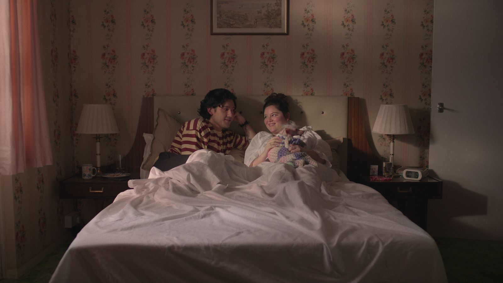 Image may contain Will Sharpe Chabeli Iglesias Lamp Bed Furniture Cup Table Lamp Person Adult Face and Head