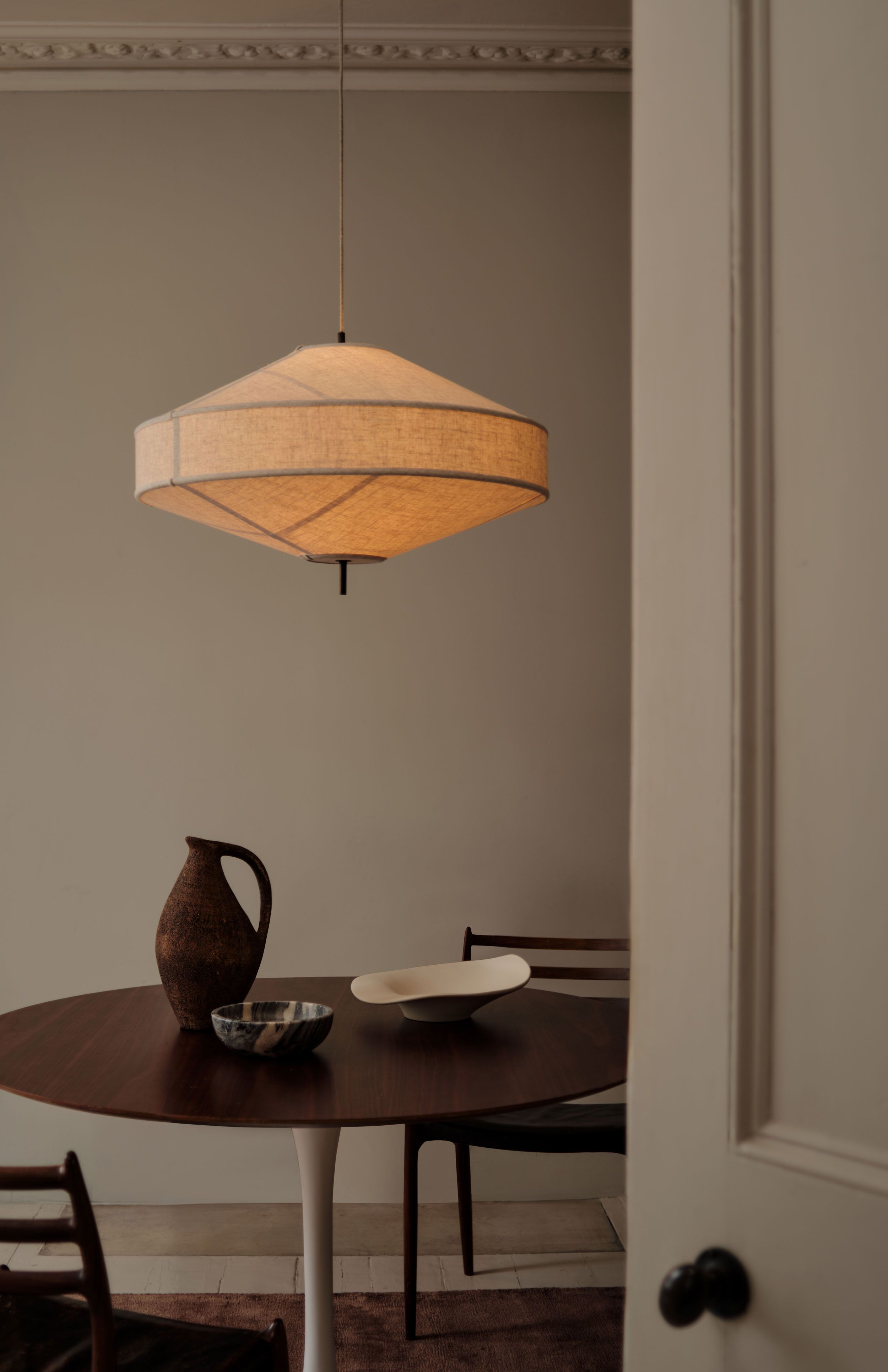 Image may contain: Lamp, Dining Table, Furniture, Table, Chair, Architecture, Building, Dining Room, Indoors, and Room