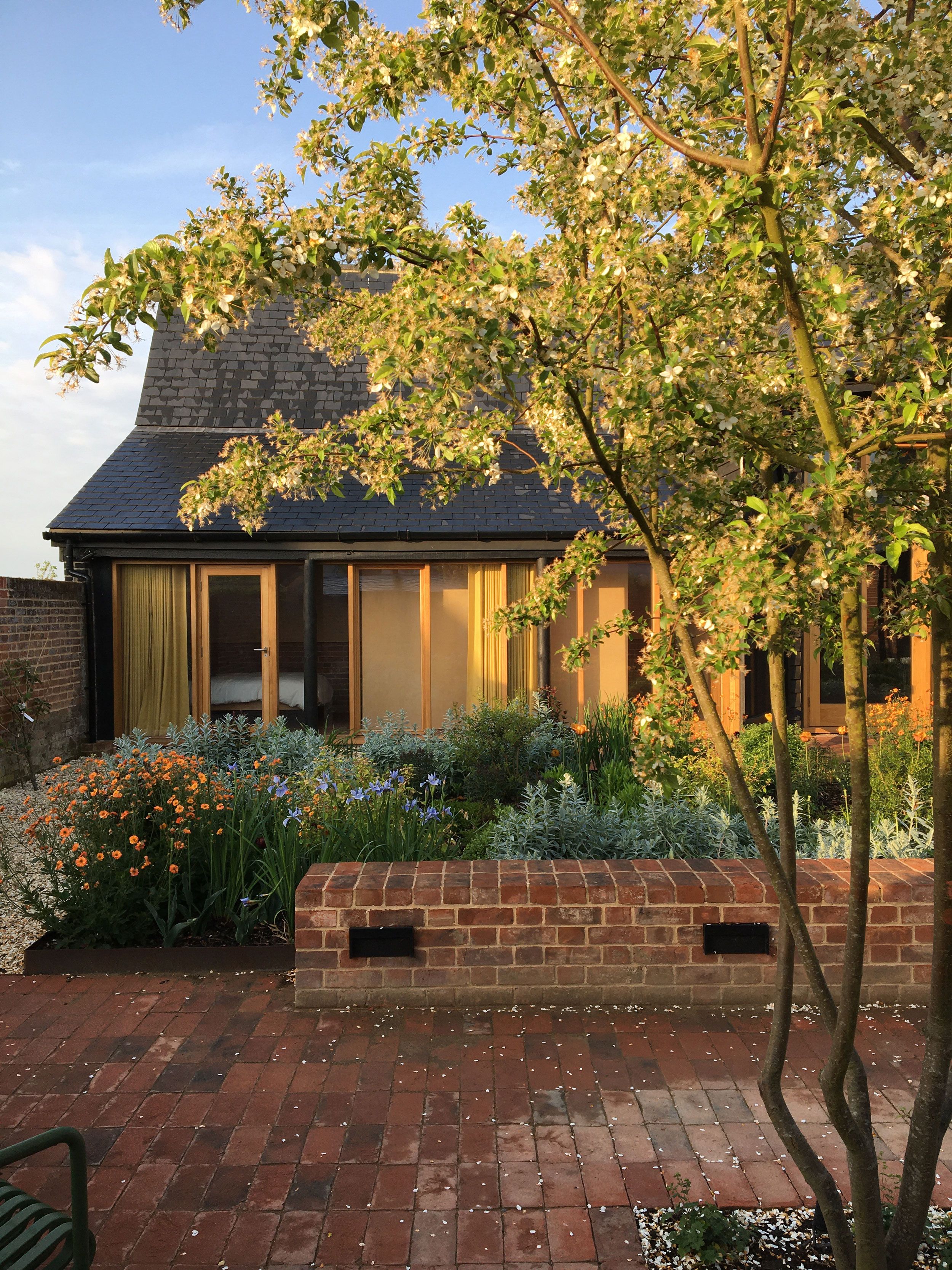 Image may contain: Path, Walkway, Backyard, Nature, Outdoors, Yard, Architecture, Building, Cottage, House, and Housing