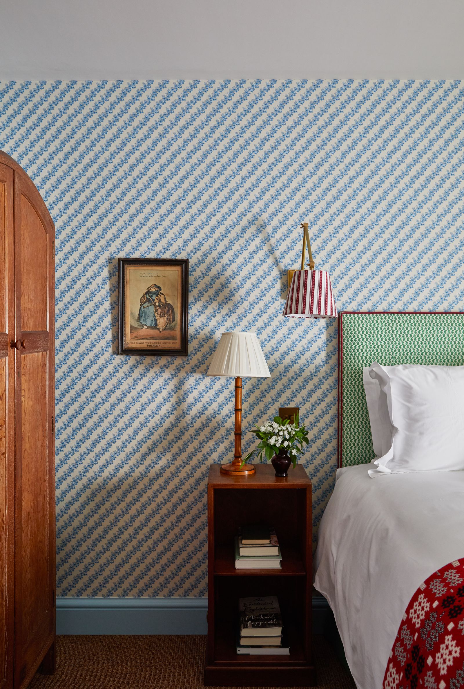 Image may contain Indoors Interior Design Lamp Art Painting Bed Furniture Architecture Building and Wall