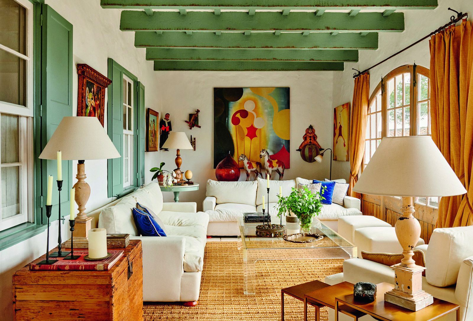 Image may contain Home Decor Architecture Building Furniture Indoors Living Room Room Lamp Plant Couch and Table