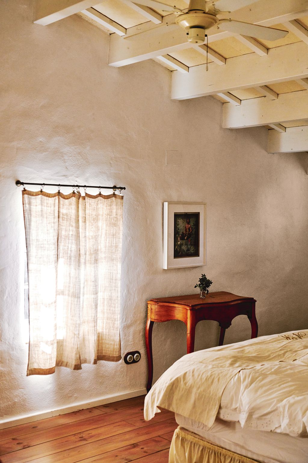 Image may contain Indoors Interior Design Bed Furniture Art Painting Corner Appliance Ceiling Fan and Device