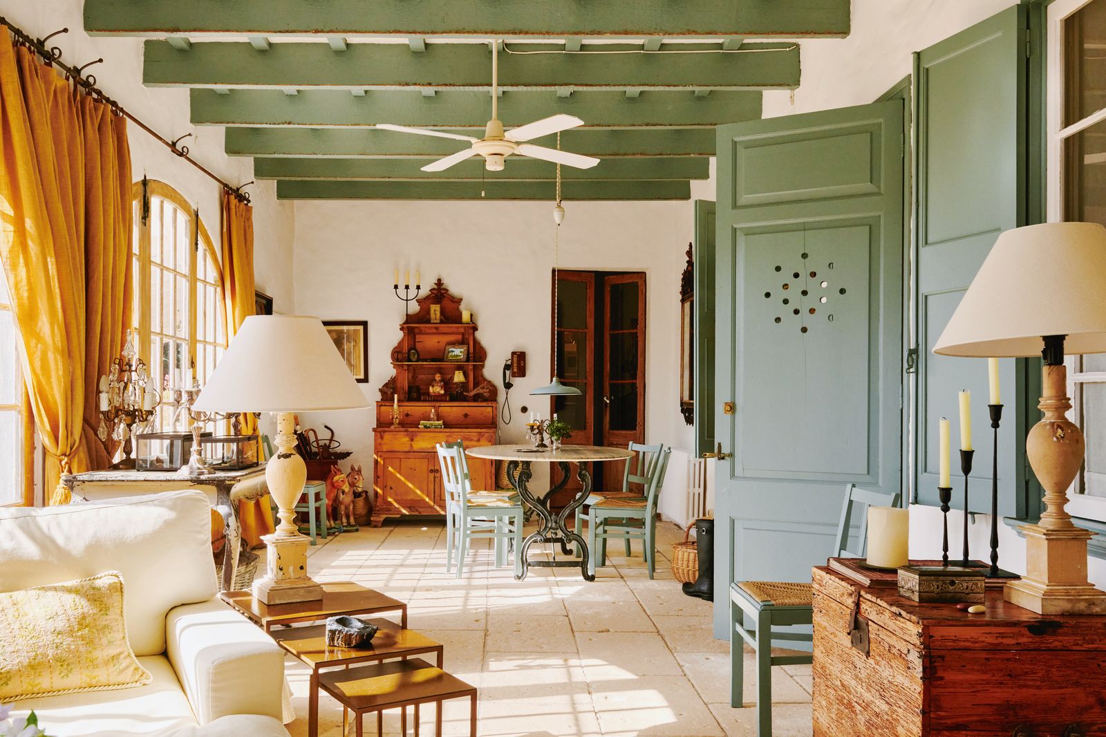 Image may contain Home Decor Lamp Desk Furniture Table Chair Couch Indoors Interior Design Art and Painting