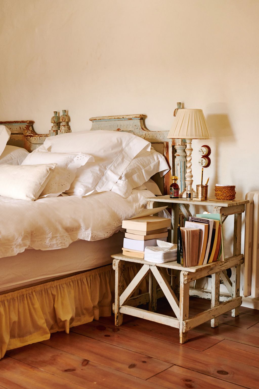 Image may contain Indoors Interior Design Lamp Wood Table Lamp Cushion Home Decor Bed Furniture Hardwood and Cup