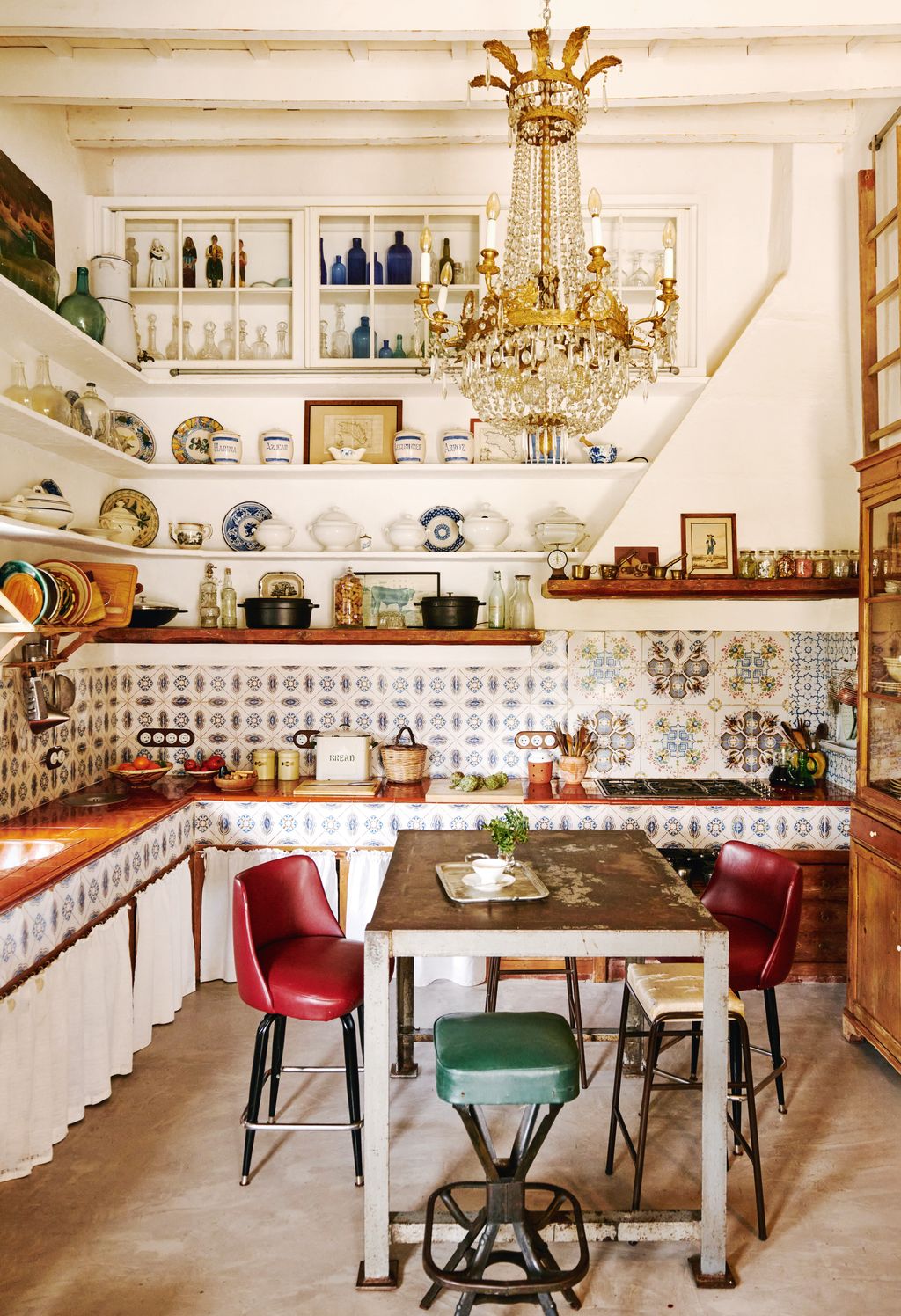 Image may contain Architecture Building Dining Room Dining Table Furniture Indoors Room Table Chandelier and Lamp