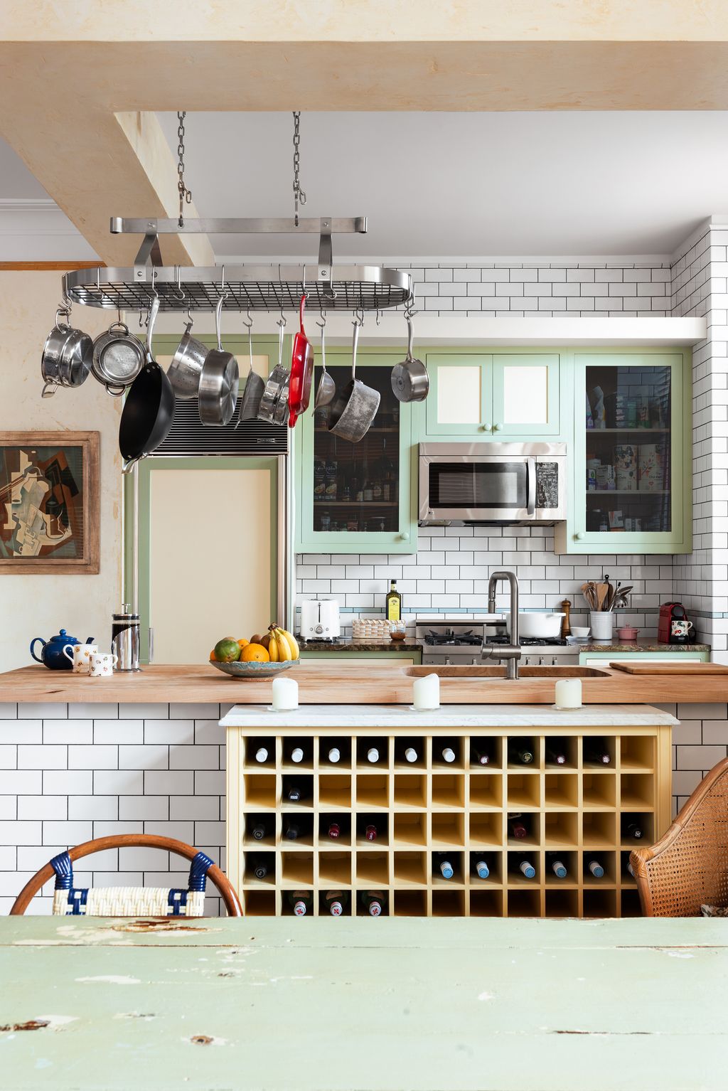 Image may contain Indoors Kitchen Appliance Device Electrical Device Microwave Oven Interior Design and Chair