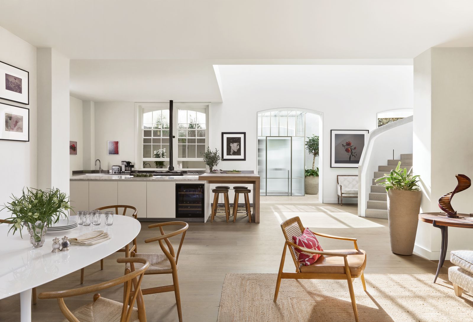 Image may contain Architecture Building Dining Room Dining Table Furniture Indoors Room Table and Plant