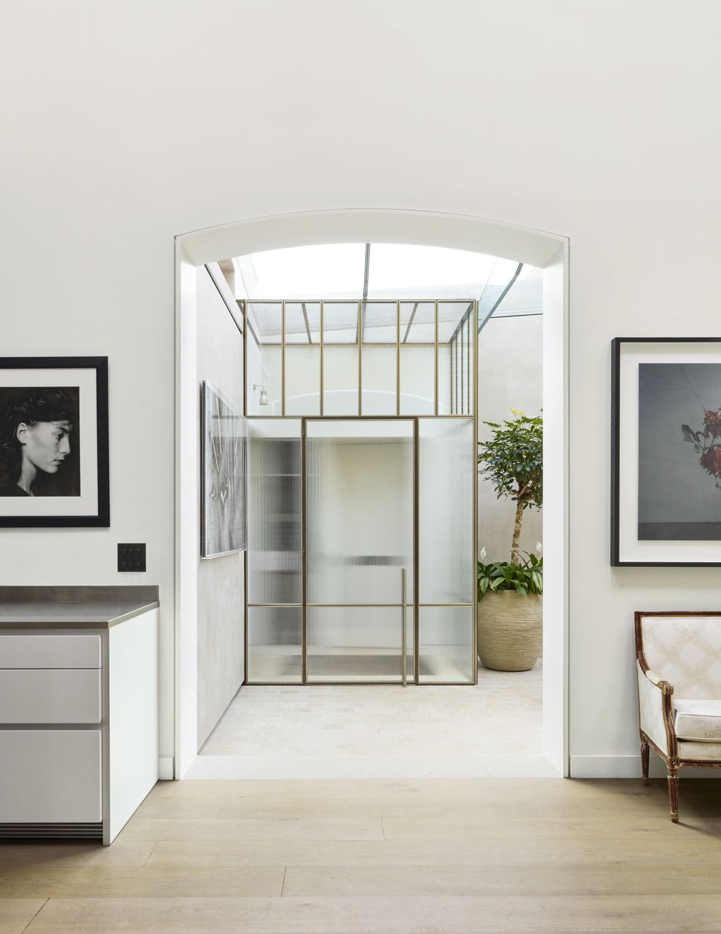 Image may contain Jane Brucker Floor Plant Chair Furniture Adult Person Art Painting Indoors and Interior Design