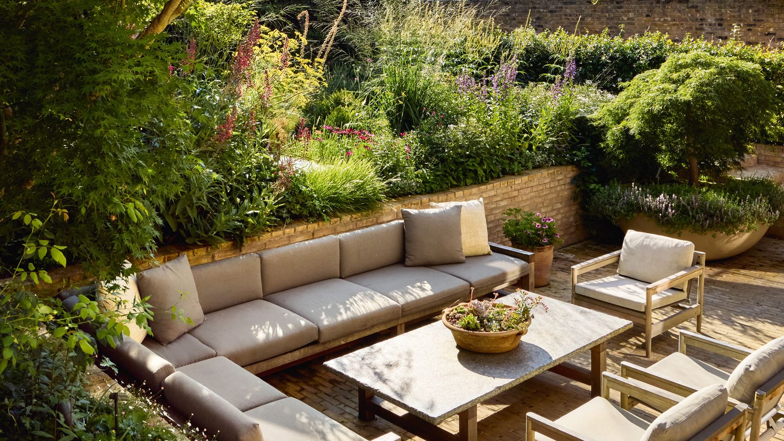 Image may contain: Backyard, Nature, Outdoors, Yard, Furniture, Table, Chair, Garden, Couch, Architecture, and Building