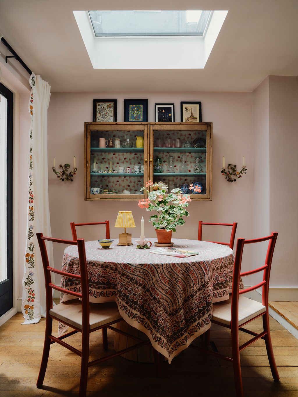 Image may contain Architecture Building Dining Room Dining Table Furniture Indoors Room Table Lamp Window and Desk