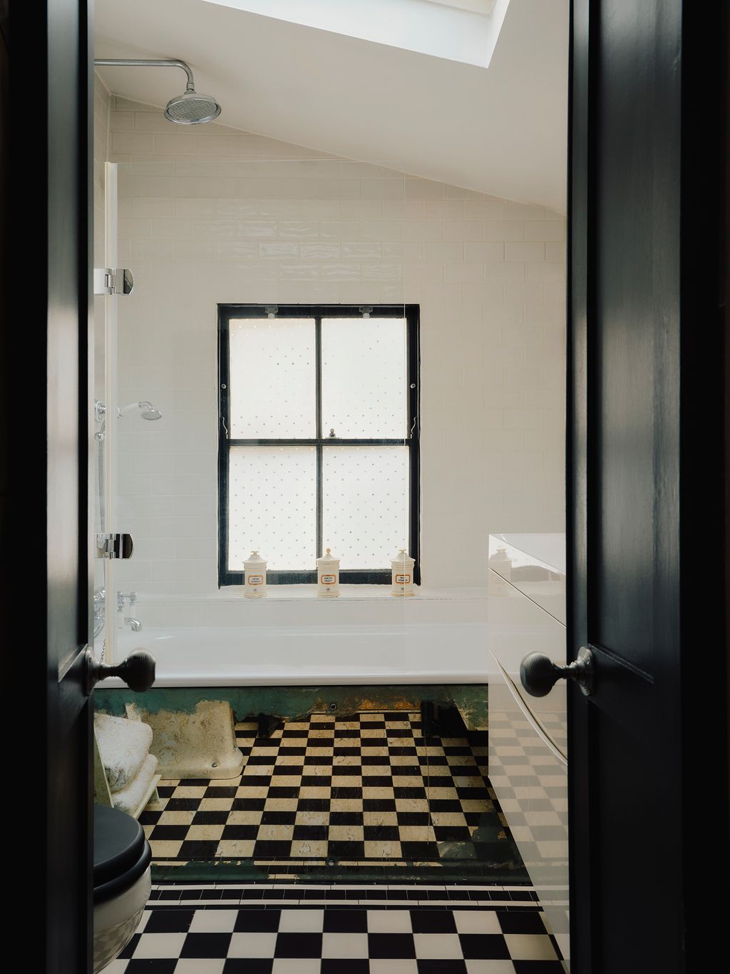 Image may contain Floor Indoors Interior Design Bathing Bathtub Person and Tub