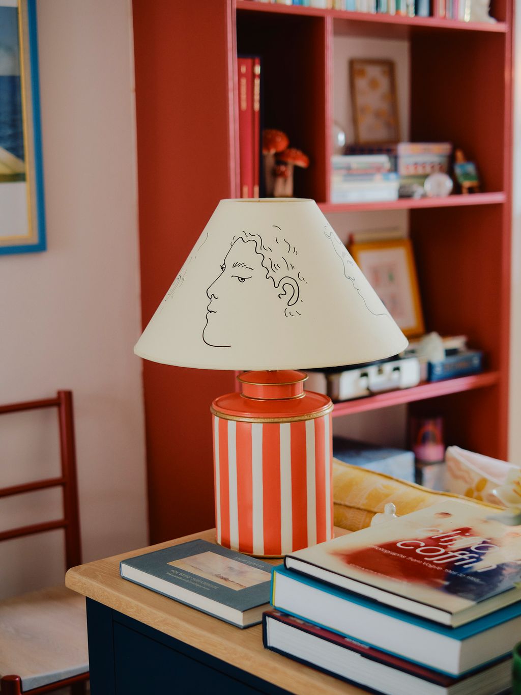 Image may contain Lamp Book Publication Table Lamp Art Painting Chair Furniture and Lampshade