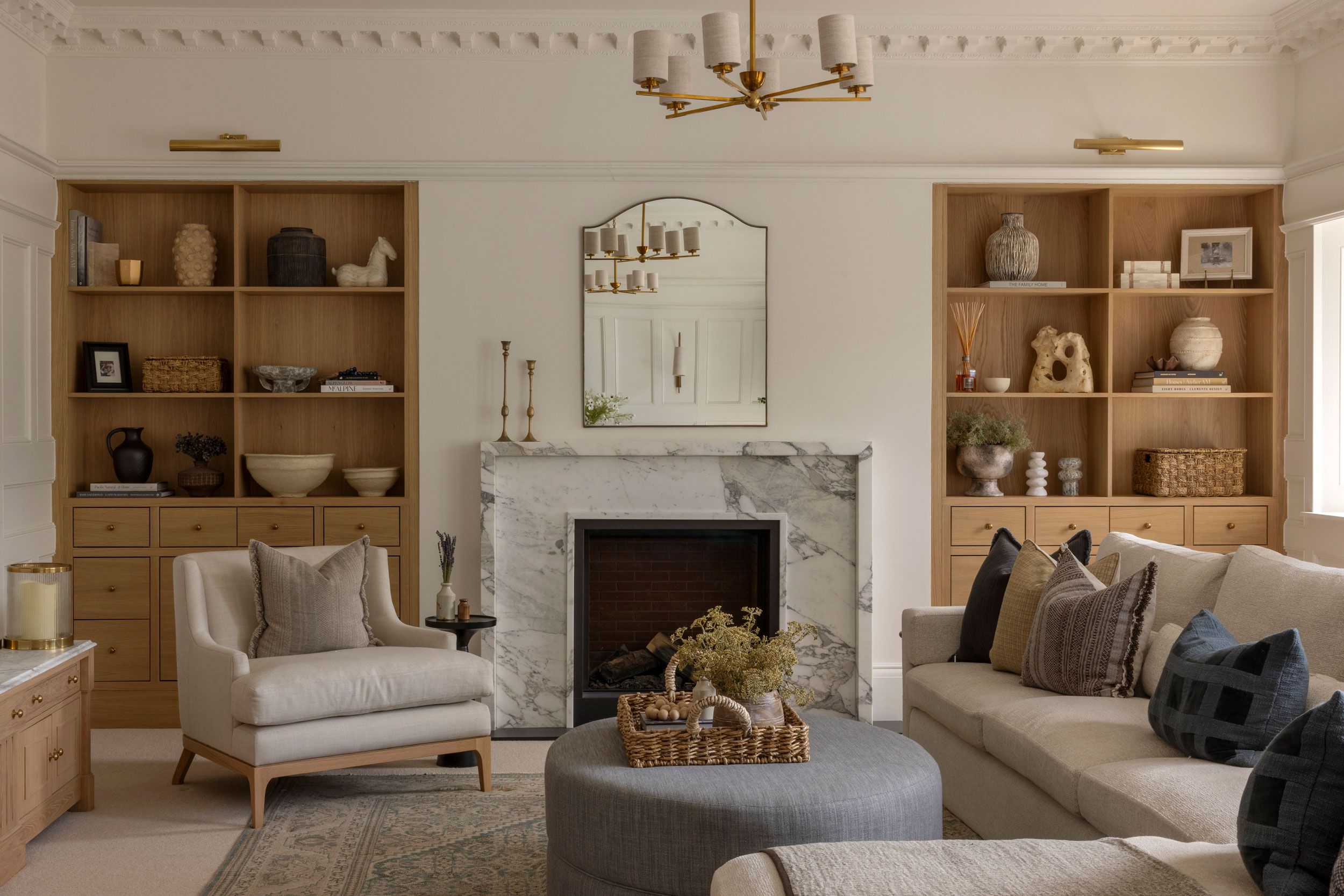 Image may contain: Home Decor, Lamp, Plant, Furniture, Couch, Chair, Art, Painting, Rug, Architecture, Building, and Indoors