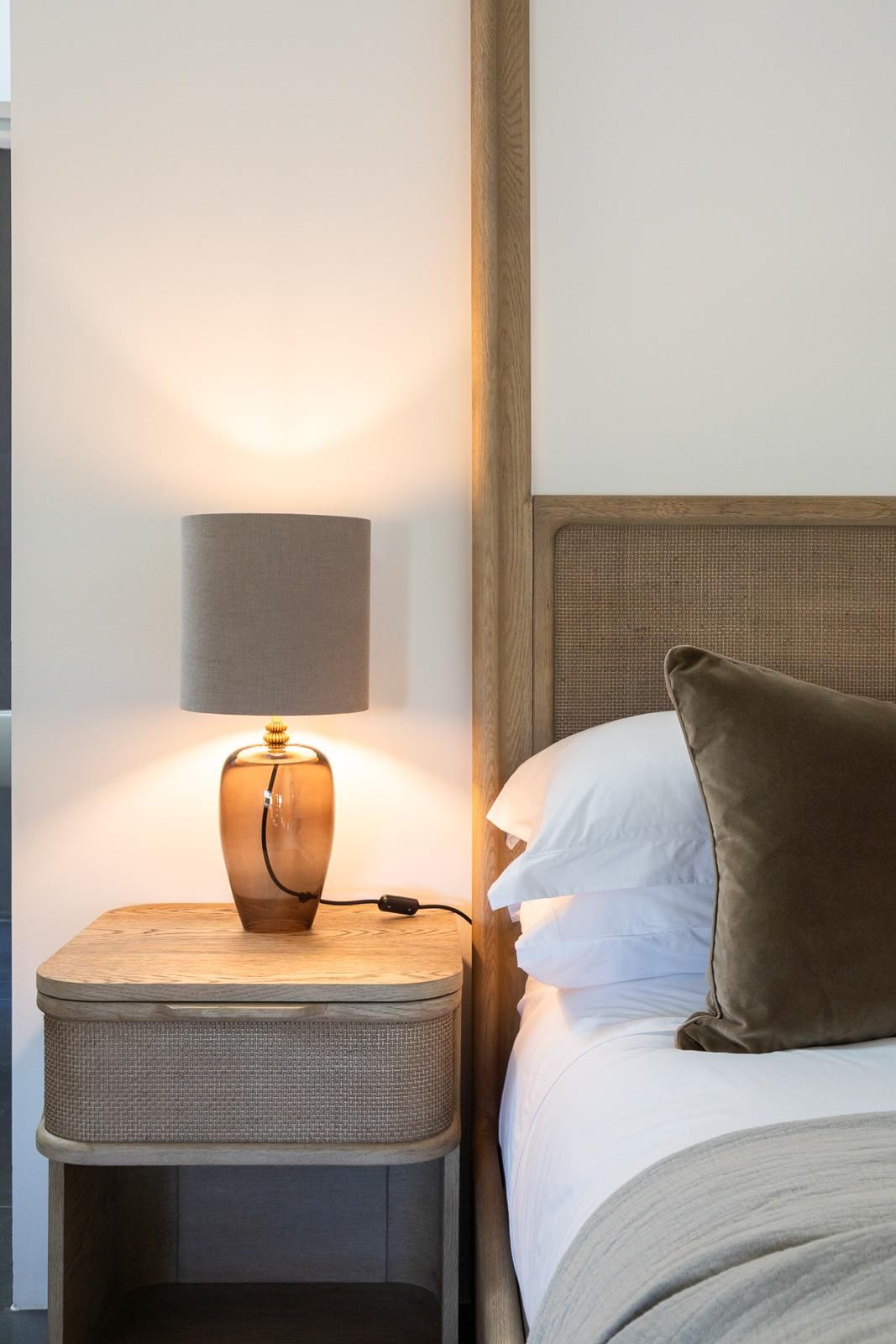 Image may contain: Lamp, Cushion, Home Decor, Table Lamp, Pillow, Bed, Furniture, Indoors, and Interior Design