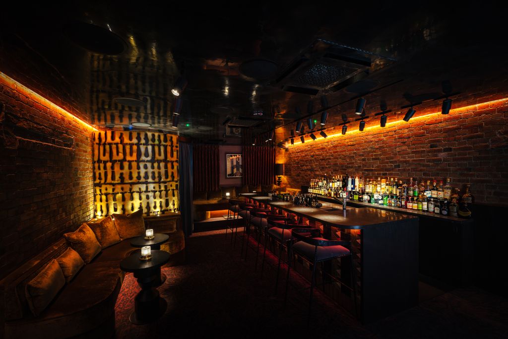 Image may contain Bar Couch Furniture Art Painting Urban Desk and Table