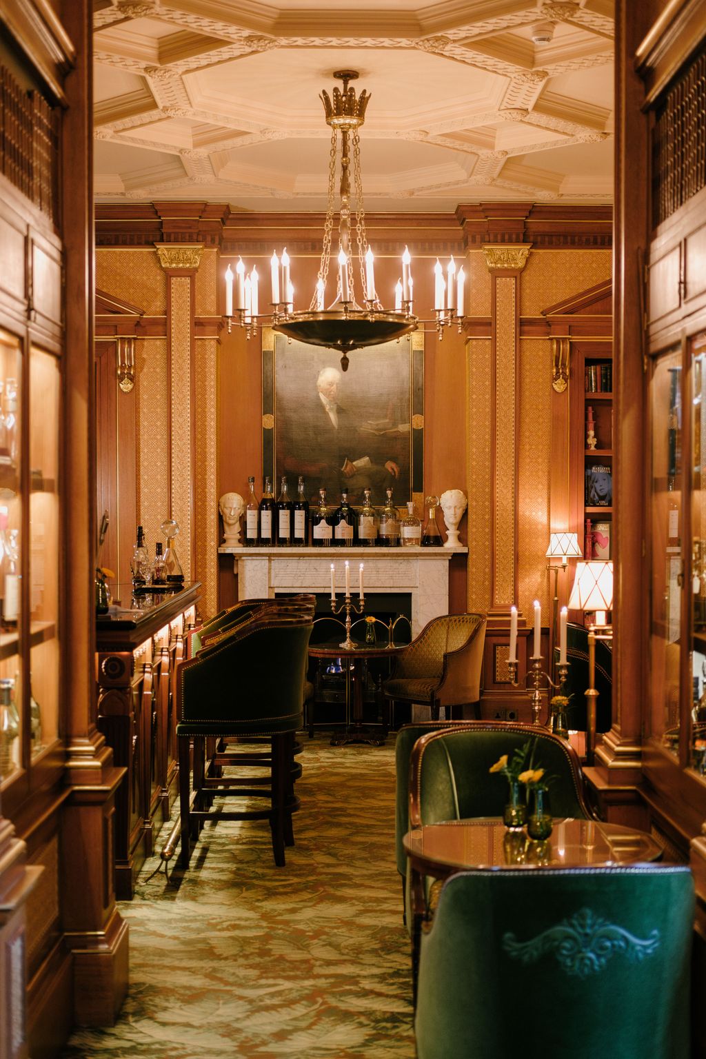 Image may contain Scopas Lamp Chair Furniture Adult Person Desk Table Candle Bar Chandelier and Cup