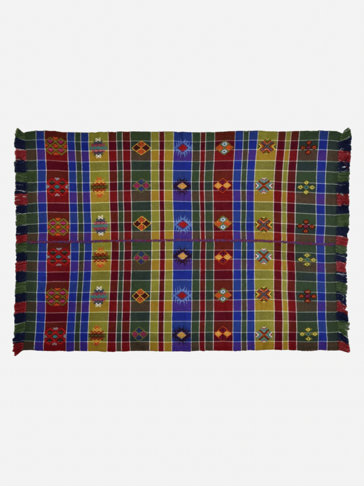 Image may contain: Home Decor, Rug, Clothing, and Skirt